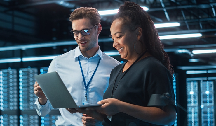 two people looking at a computer